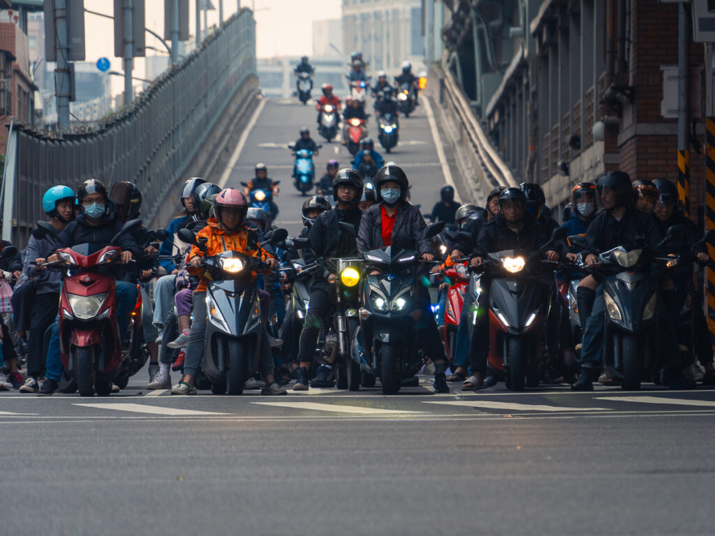 The Taipei Scooter Waterfall at the base of the Taipei Bridge is a must photograph Taipei Photo Spot with all the moped scooters.