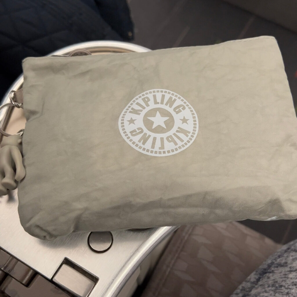 A Kipling amenity kit is given to passengers in EVA Air Premium Economy.